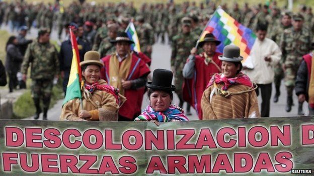 Indigenous authorities march in front of low-ranking army officers in La Paz, April 24, 2014.