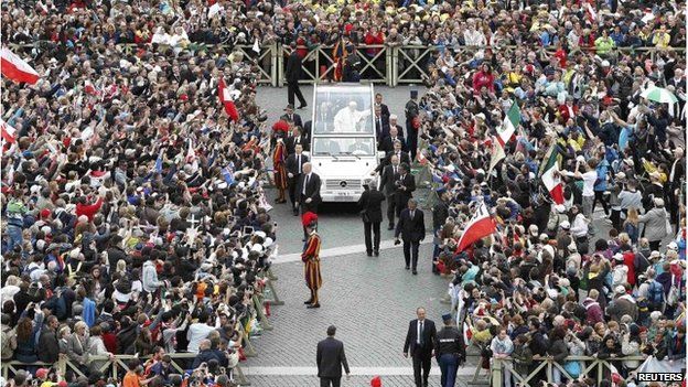 Pope Francis greets the faithful n St Peter's Square at the Vatican April 27