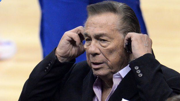 Los Angeles Clippers owner Donald Sterling stands courtside at an NBA game.