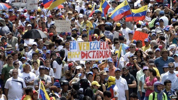 Anti-government activists hold a protest against President Nicolas Maduro in Caracas on 26 April, 2014