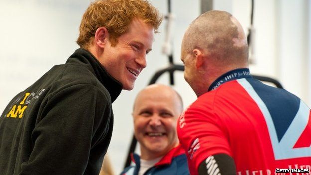 Prince Harry (L) meets veteran Jamie Hull (R) training for the Invctus Games
