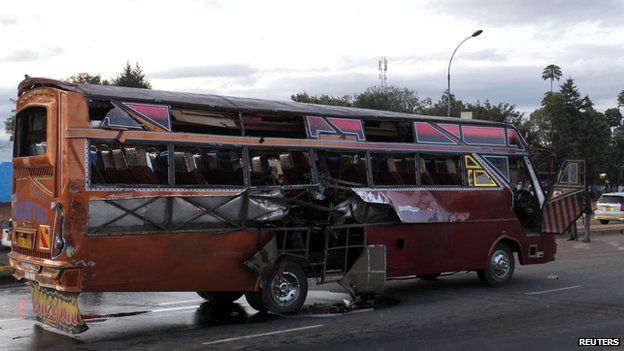 A bus damaged after an explosion is seen along the Thika super-highway in Kenya's capital Nairobi, on 4 May 2014.