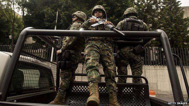 Mexican Navy marines patrol in a truck on 16 July, 2013