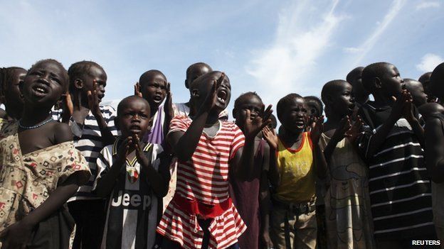Children sing slogans against South Sudan's President Salva Kiir in an IDP (internally displaced persons) camp in the United Nations Mission In South Sudan base in Juba on 6 May 2014