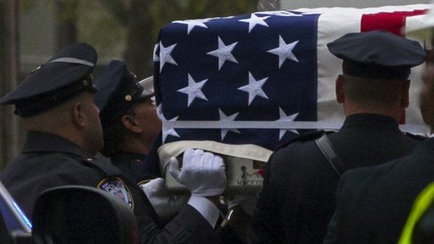 Emergency personnel carry a casket draped with a U.S. flag during the ceremonial transfer of the 9/11 unidentified remains to the Office of the Chief Medical Examiner of the City of New York (OCME) repository at the World Trade Center site, in New York May 10