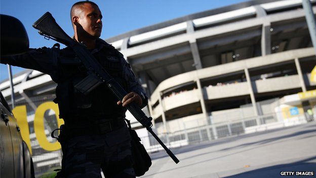 An armed policeman outside the Maracana football stadium in Rio de Janeiro, Brazil