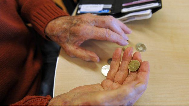 Pensioner handling money