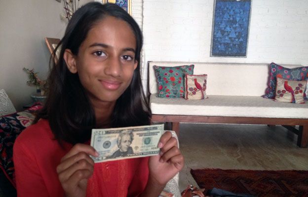 Laila Alva with the $20 note