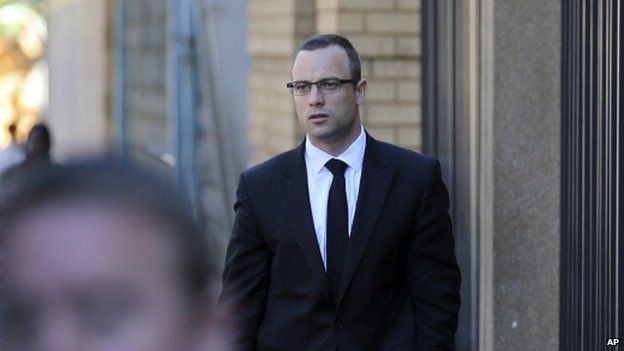 Oscar Pistorius walks towards the high court in Pretoria on Tuesday