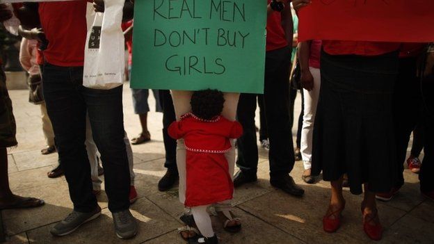 Nigerians take part in a protest called for the release of the abducted secondary school girls in the remote village of Chibok in Nigeria, at La Merced square in Malaga, southern Spain on 13 May 2014