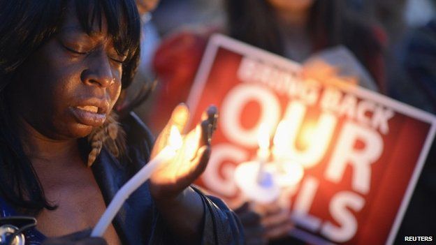 People participate in a "Bring Back Our Girls" campaign demonstration and candlelight vigil, held on Mother's Day in Los Angeles on 11 May 2014