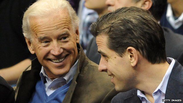 Joe Biden (left) talks with his son Hunter at basketball game in 2010.