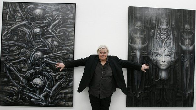 HR Giger with his artworks