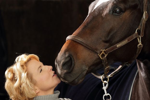 Verity Smith is almost kissing her horse