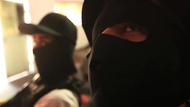 Masked members of drug cartel
