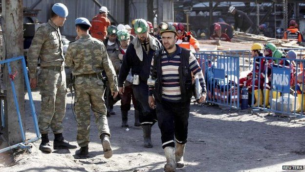 Rescuers walk towards a coal mine site after a mine explosion in Soma, a district in Turkey's western province of Manisa, 16 May 2014