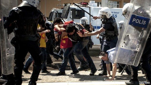 Riot police beat protesters during a demonstration to blame the ruling AK Party (AKP) government on mining disaster in Izmir, western Turkey, 15 May 2014