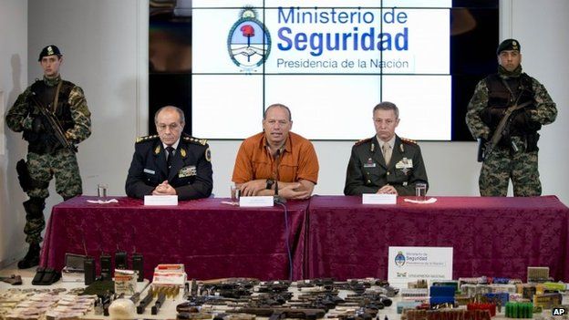 Argentina's Security minister, Sergio Berni, (centre) gives press conference