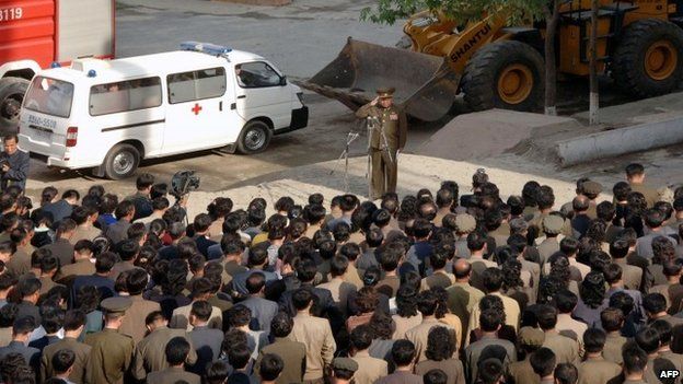 A construction division officer (top) apologising to residents following the 13 May serious accident in the construction site of an apartment house in Phyongchon district, Pyongyang (May 2014)