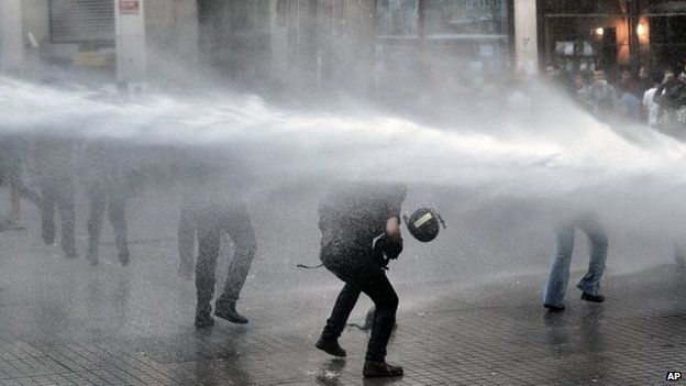 Riot police use water cannons and teargas to disperse people who were protesting the Soma mine accident that killed 301 miners, in Istanbul, Turkey, 17 May 2014