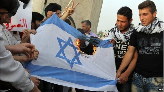 Iranians burn Israeli flag in Tehran (file photo)