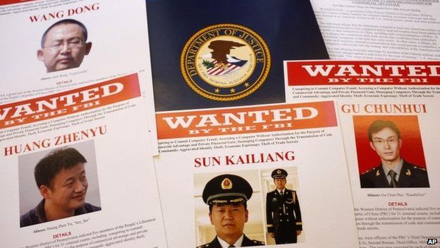 Press materials are displayed on a table of the Justice Department in Washington 19 May 2014