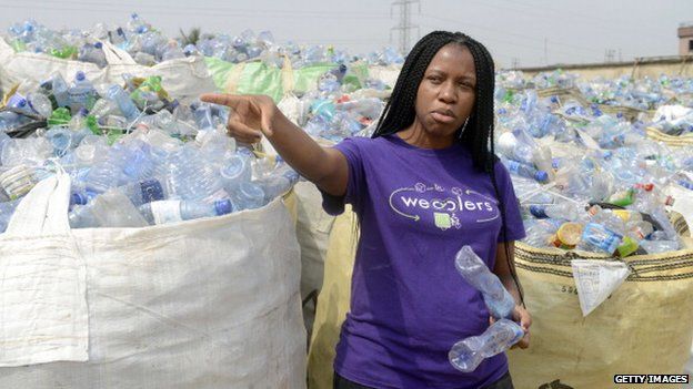 Bilikiss Adebiyi-Abiola in front of bags of plastic bottles