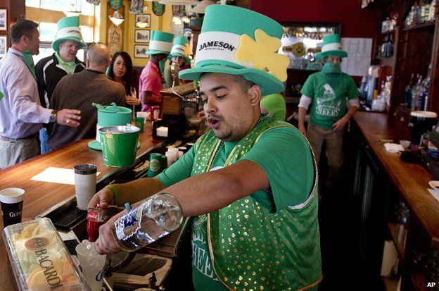 Bartender pours drink on St. Patrick's Day at The Gooses Acre Bistro and Irish Pub in The Woodlands, Texas