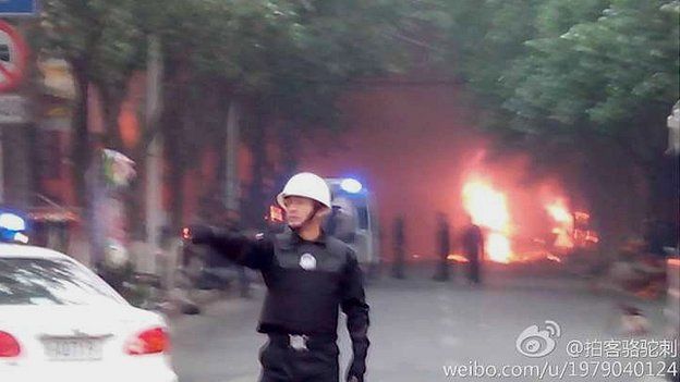 Police near presumed scene of attack in Urumqi (22 May)