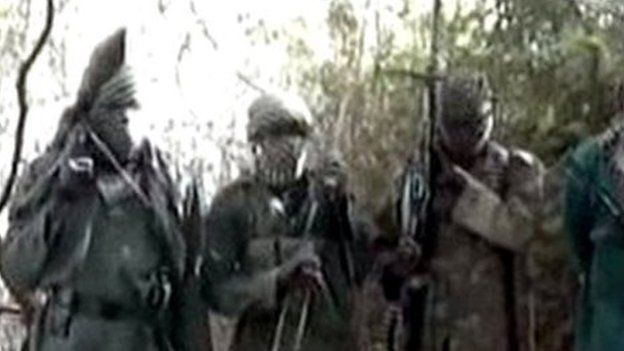 A picture taken from a video distributed to some Nigerian journalists and obtained by AFP on 5 March 2013 showing hooded Boko Haram fighters in an undisclosed place