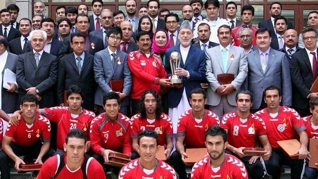 President Karzai holds the South Asia Cup trophy