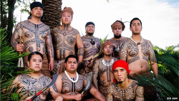 Group showing off their Filipino tribal tattoos