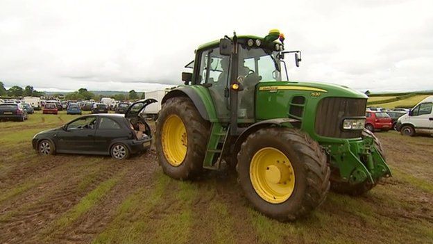Tractor pulls car