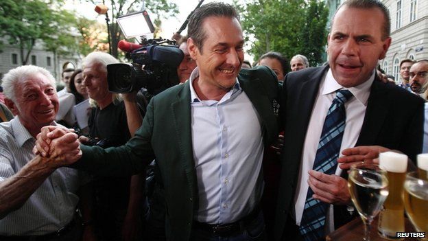 Head of Austria's far-right Freedom Party Heinz-Christian Strache (c) and top candidate Harald Vilimsky (r) celebrate in Vienna 25 May, 2014.
