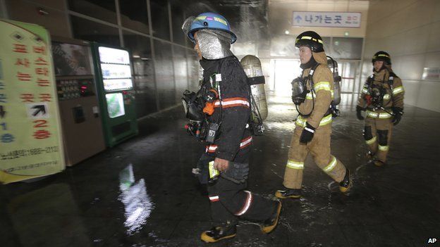 South Korean firefighters arrive at a bus terminal at Goyang, north of Seoul, South Korea, on Monday, 26 May, 2014