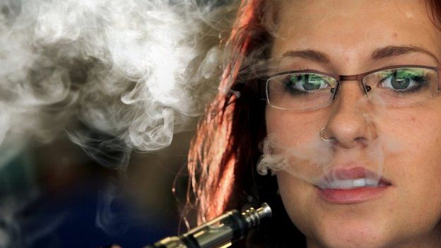 Leah Overbaugh poses with an e-cigarette