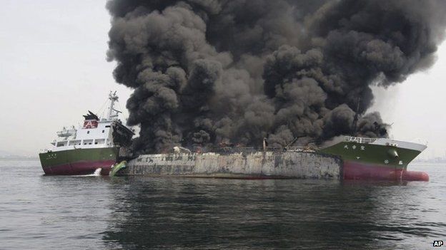 In this photo released by Japan's 5th Regional Coast Guard, clouds of black smoke billow from Shoko Maru, a 998-ton Japanese oil tanker, after it exploded off the southwest coast near Himeji port, western Japan, Thursday, 29 May 2014