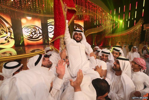 Saif al-Mansuri being held aloft by other contestants on Million's Poet