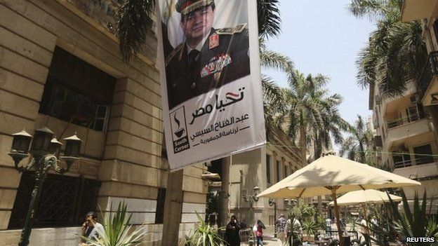 A poster of Abdel Fattah al-Sisi hangs outside the stock exchange in Cairo on 29 May 29, after his overwhelming percent victory