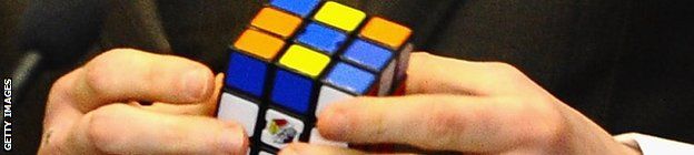 George Groves' mind games include playing with a Rubik's cube in the first press conference for the rematch