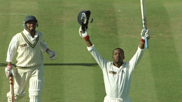 Brian Lara celebrates his world record 501 not out at Edgbaston, after a then record 322-run stand with Keith Piper