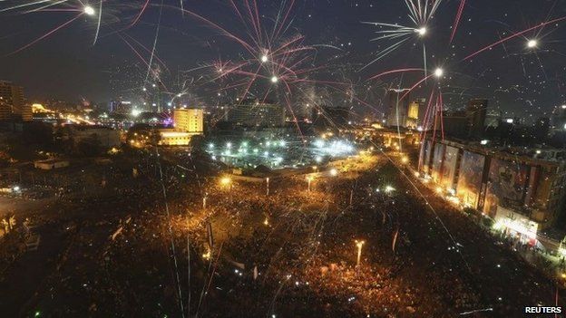 Fireworks explode in Tahrir Square on 8 June 2014