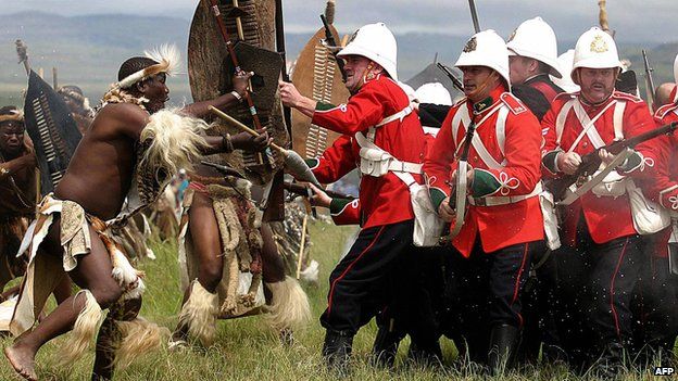 A group in British uniforms is assailed by Zulu warriors during the 125th Anniversary re-enactment of the battle of Isandlwana some 350 kilometres north of Durban on 24 January 2004.