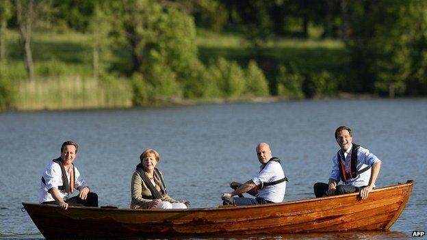 David Cameron, Angela Merkel, Fredrik Reinfeldt and Mark Rutte talk in a boat near the summer residence of the Swedish Prime Minister