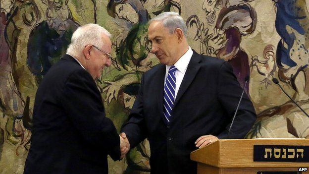 Israel's newly elected President Reuven Rivlin is greeted by Prime Minister Benjamin Netanyahu