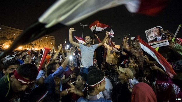 Egyptians celebrate in Tahrir Square in Cairo after Abdel Fattah al-Sisi won Egypt's presidential election - 3 June 2014