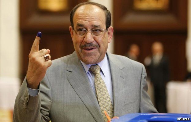 Nouri Maliki has his finger marked with ink after voting in the April 2014 parliamentary election