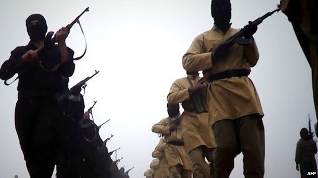ISIS fighters marching at an undisclosed location taken from screen grab of video released on 4 January 2014