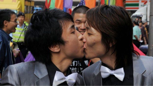 File photo: Rally participants take part in a gay and lesbian rally through the streets in Hong Kong on 13 December 2008