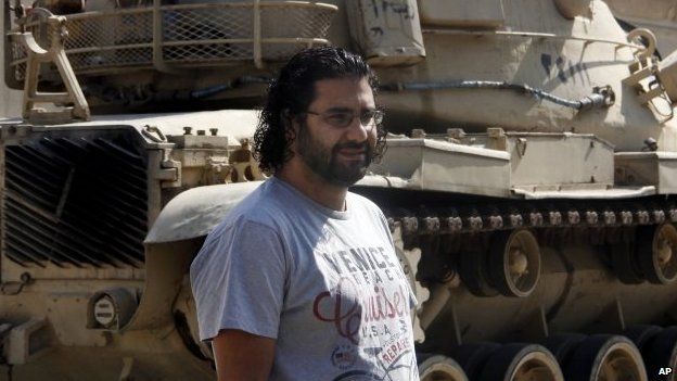 Prominent Egyptian blogger Alaa Abdul Fattah stands in front of a criminal court in Cairo, Egypt, 11 June 2014